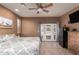 Main bedroom with private access to backyard and ceiling fan at 42644 N Schnepf Rd, San Tan Valley, AZ 85140