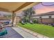 Artificial turf backyard with patio cover at 4707 S Avitus Ln, Mesa, AZ 85212