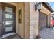 Front entry with a brown door and brick columns at 4707 S Avitus Ln, Mesa, AZ 85212