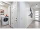 Convenient laundry room with washer and dryer, and extra storage at 4707 S Avitus Ln, Mesa, AZ 85212