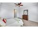 Bedroom with queen bed, dresser, and ceiling fan at 4707 S Avitus Ln, Mesa, AZ 85212