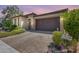Two-car garage and manicured landscaping at 4707 S Avitus Ln, Mesa, AZ 85212
