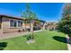 Backyard with artificial turf, lounge chairs, and patio at 4707 S Avitus Ln, Mesa, AZ 85212