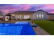 Inviting pool with outdoor kitchen and seating area at 3902 W Ruby Way, Queen Creek, AZ 85142