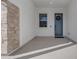 Inviting front entry with blue door and stone accent at 3902 W Ruby Way, Queen Creek, AZ 85142