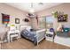 Charming bedroom with a twin-size bed and plenty of storage at 10758 E Lobo Ave, Mesa, AZ 85209