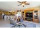 Spacious Gathering room with a fireplace and built-in entertainment center at 18364 N Diamond Dr, Surprise, AZ 85374