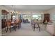 Open concept living and dining area with golf course views at 18364 N Diamond Dr, Surprise, AZ 85374