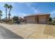Two-story home with a three-car garage and palm trees at 18364 N Diamond Dr, Surprise, AZ 85374