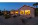 Evening view of backyard, showcasing home's exterior and landscaping at 18364 N Diamond Dr, Surprise, AZ 85374