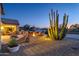 Landscaped backyard with fire pit and desert plants at 18364 N Diamond Dr, Surprise, AZ 85374