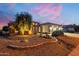 Stunning curb appeal with desert landscaping at sunset at 18364 N Diamond Dr, Surprise, AZ 85374