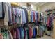Large walk-in closet with ample hanging space and shelving at 18364 N Diamond Dr, Surprise, AZ 85374