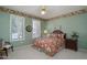 Bright bedroom with a leafy floral comforter and plenty of natural light at 18364 N Diamond Dr, Surprise, AZ 85374