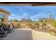 Spacious backyard patio with seating area, fire pit, and golf course view at 18364 N Diamond Dr, Surprise, AZ 85374