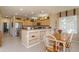 Well-equipped kitchen with light wood cabinets, granite countertops, and stainless steel appliances at 18364 N Diamond Dr, Surprise, AZ 85374