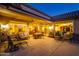 Extended patio with seating area and views into the home at 18364 N Diamond Dr, Surprise, AZ 85374