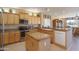 Modern kitchen featuring granite countertops and stainless steel appliances at 18364 N Diamond Dr, Surprise, AZ 85374