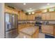 Island kitchen with granite countertops and stainless steel appliances at 18364 N Diamond Dr, Surprise, AZ 85374