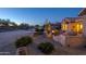Evening view of backyard patio with fire pit and grill at 18364 N Diamond Dr, Surprise, AZ 85374