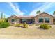 View of home's back elevation, showcasing landscaping and desert plants at 18364 N Diamond Dr, Surprise, AZ 85374