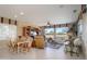 Bright living room with golf course views, featuring comfortable seating and built-in shelving at 18364 N Diamond Dr, Surprise, AZ 85374