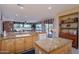 Open kitchen with granite counters, stainless steel appliances, and breakfast bar at 18364 N Diamond Dr, Surprise, AZ 85374