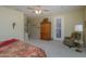 Main bedroom with large windows and patio access, featuring a king-size bed and sitting area at 18364 N Diamond Dr, Surprise, AZ 85374