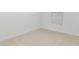 Empty bedroom with neutral carpet and a window with blinds at 7862 N 80Th Ave, Glendale, AZ 85303