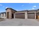 Modern home with stone accents and two-car garage at 37750 W Padilla St, Maricopa, AZ 85138