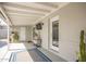 Covered patio with outdoor rug and potted plants at 7313 E Fillmore St, Scottsdale, AZ 85257