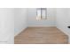 Simple bedroom with wood-look flooring and neutral decor at 37735 W Padilla St, Maricopa, AZ 85138