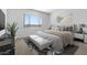 Main bedroom with plush bed, light decor, and window at 37735 W Padilla St, Maricopa, AZ 85138
