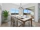 Elegant dining room with marble table and access to back patio at 37735 W Padilla St, Maricopa, AZ 85138