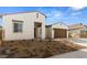 New construction home's front exterior with two-car garage and desert landscaping at 37735 W Padilla St, Maricopa, AZ 85138