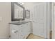 Bathroom with granite countertop and large mirror at 406 E Glenhaven Dr, Phoenix, AZ 85048