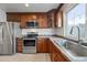 Kitchen with stainless steel appliances, wood cabinets, and large sink at 5810 N 8Th Pl, Phoenix, AZ 85014