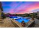 Stunning pool and spa at night with colorful lights at 12666 E Crystal Forest --, Gold Canyon, AZ 85118