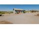 Gray house with red door and desert landscape view at 44025 N Us Hwy 60 --, Morristown, AZ 85342