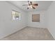 Bedroom featuring a ceiling fan and two windows at 2325 W Highridge Rd, Wickenburg, AZ 85390