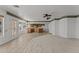 Open living room with tile and carpet flooring, and kitchen views at 2325 W Highridge Rd, Wickenburg, AZ 85390