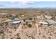 Aerial view of house and neighborhood in desert landscape at 2325 W Highridge Rd, Wickenburg, AZ 85390