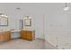 Bathroom features double vanity, soaking tub and tile floors at 2325 W Highridge Rd, Wickenburg, AZ 85390