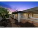 Relaxing backyard patio area with pergola and flagstone pathway at 2325 W Highridge Rd, Wickenburg, AZ 85390