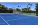 Two lighted tennis courts with blue surfaces at 12794 W Burnside Trl, Peoria, AZ 85383