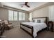 Spacious bedroom with a king-size bed and plenty of natural light at 12794 W Burnside Trl, Peoria, AZ 85383