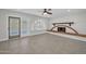 Living room with fireplace, arched window, and patio access at 5312 E Evans Dr, Scottsdale, AZ 85254