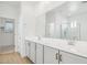 Double vanity bathroom with a large mirror and tile flooring at 6412 N 17Th Pl, Phoenix, AZ 85016
