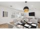 Bright dining area with modern light fixture and seating for six at 6412 N 17Th Pl, Phoenix, AZ 85016