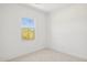 Simple bedroom with a window and carpeted floor at 6412 N 17Th Pl, Phoenix, AZ 85016